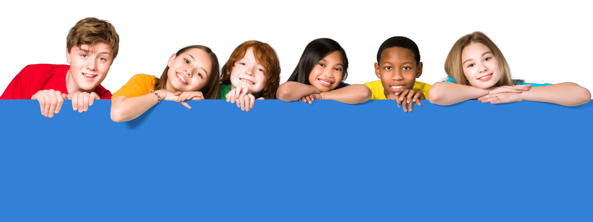 Smiling children of many backgrounds leaning over a banner