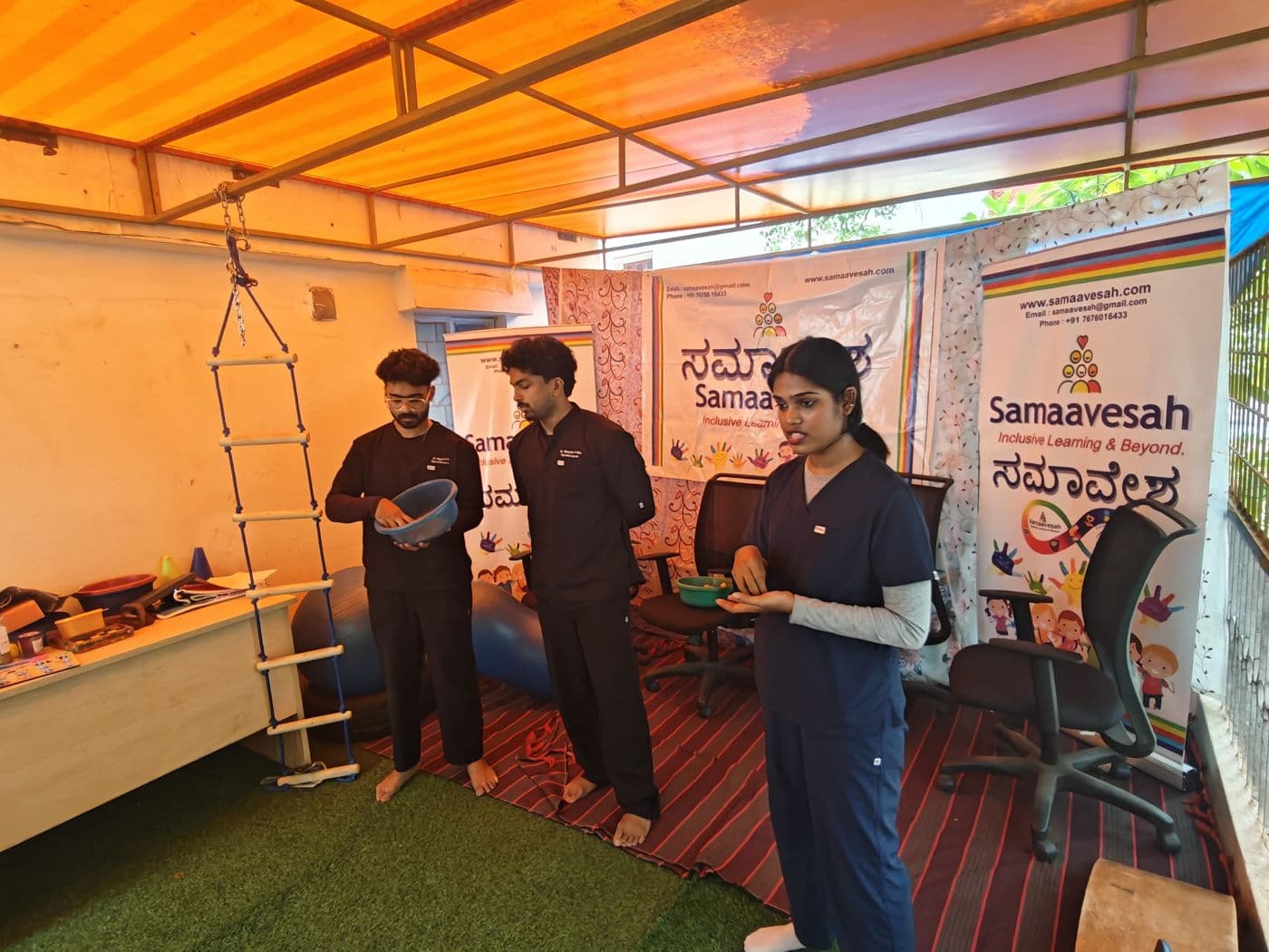 Therapists guiding activities in the therapy space