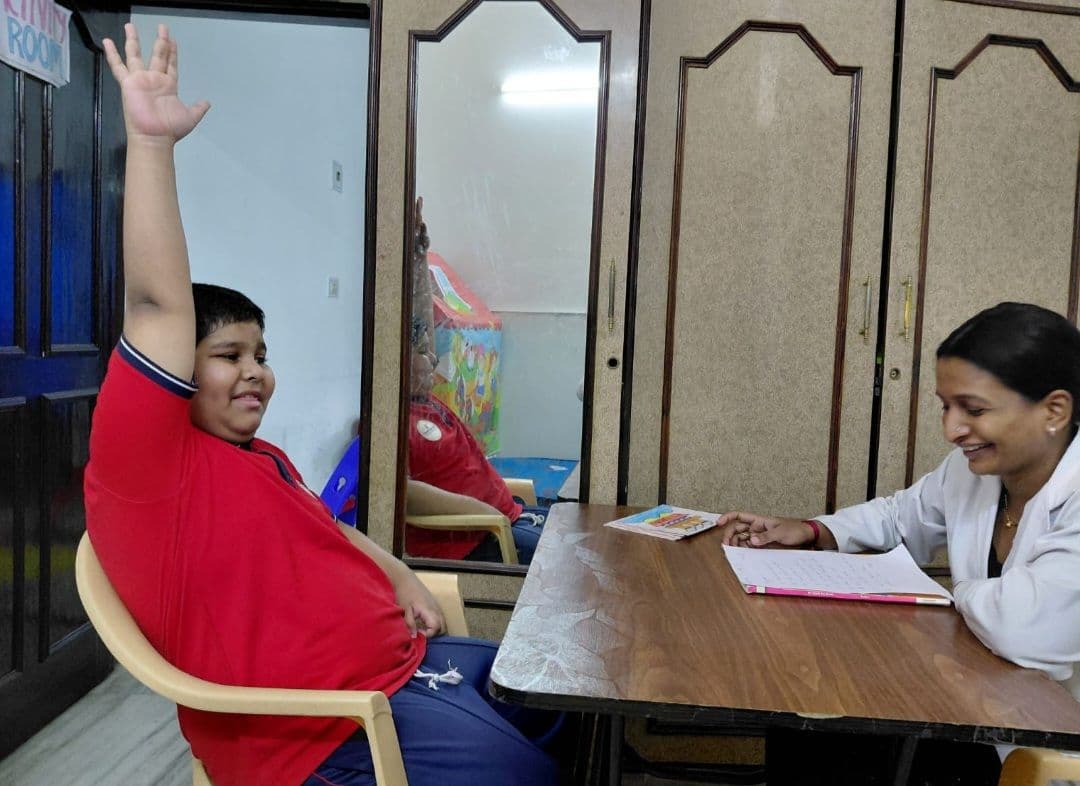 Therapist working with a child using flash cards