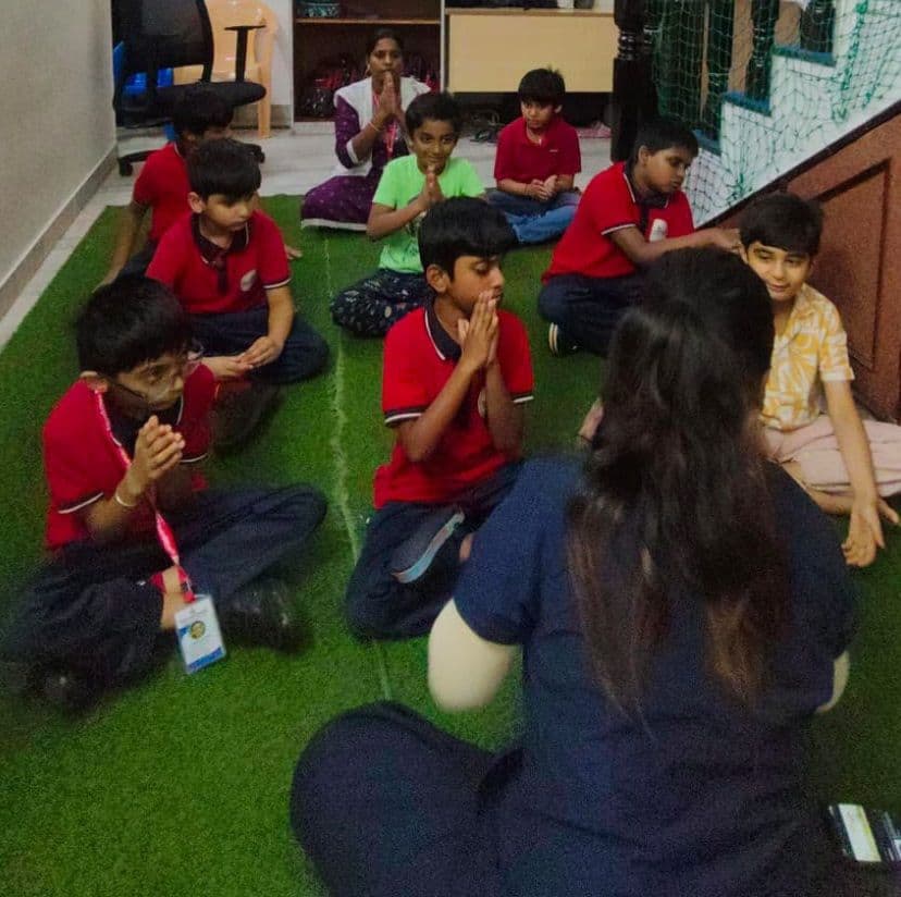 Children practising breathing exercises together