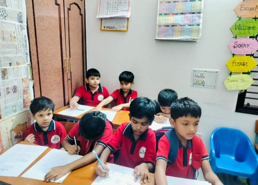 Students writing at their desks in class
