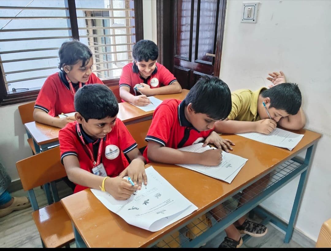 Students completing worksheets together