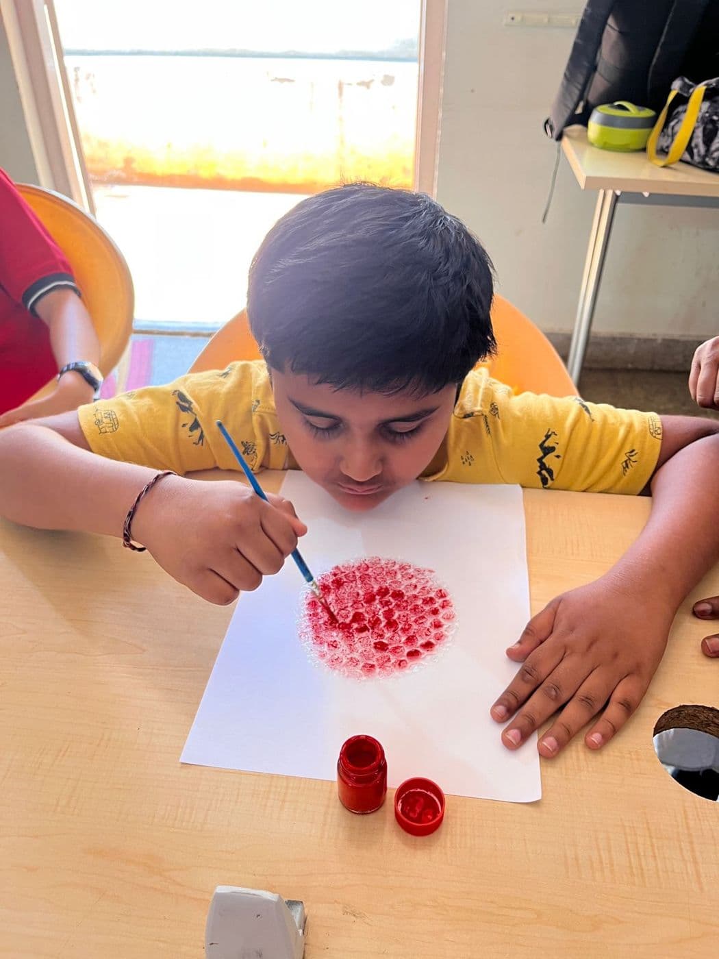 Finger-painting during an art session