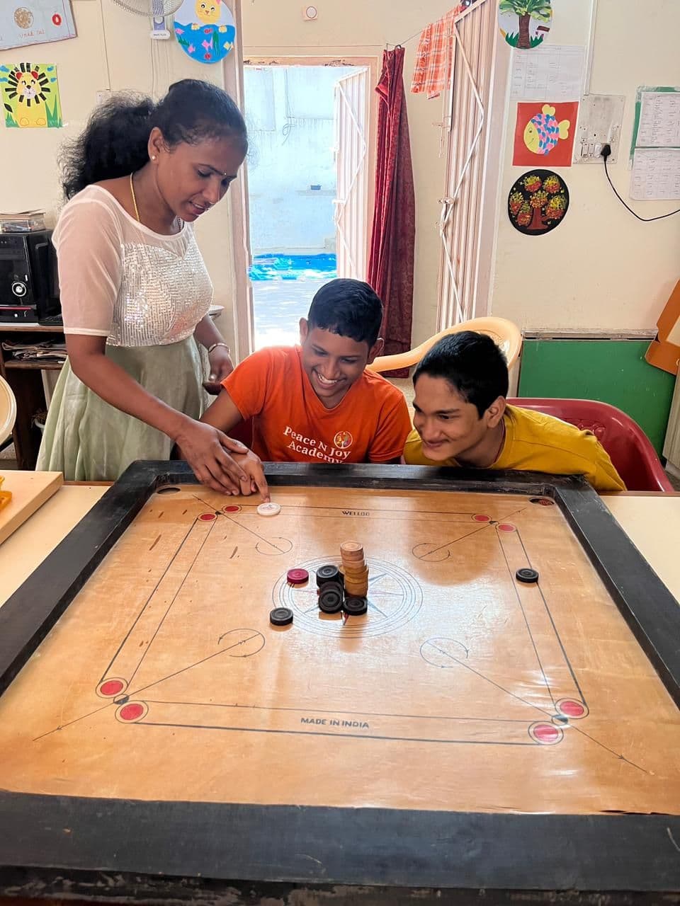 A game of carrom with friends