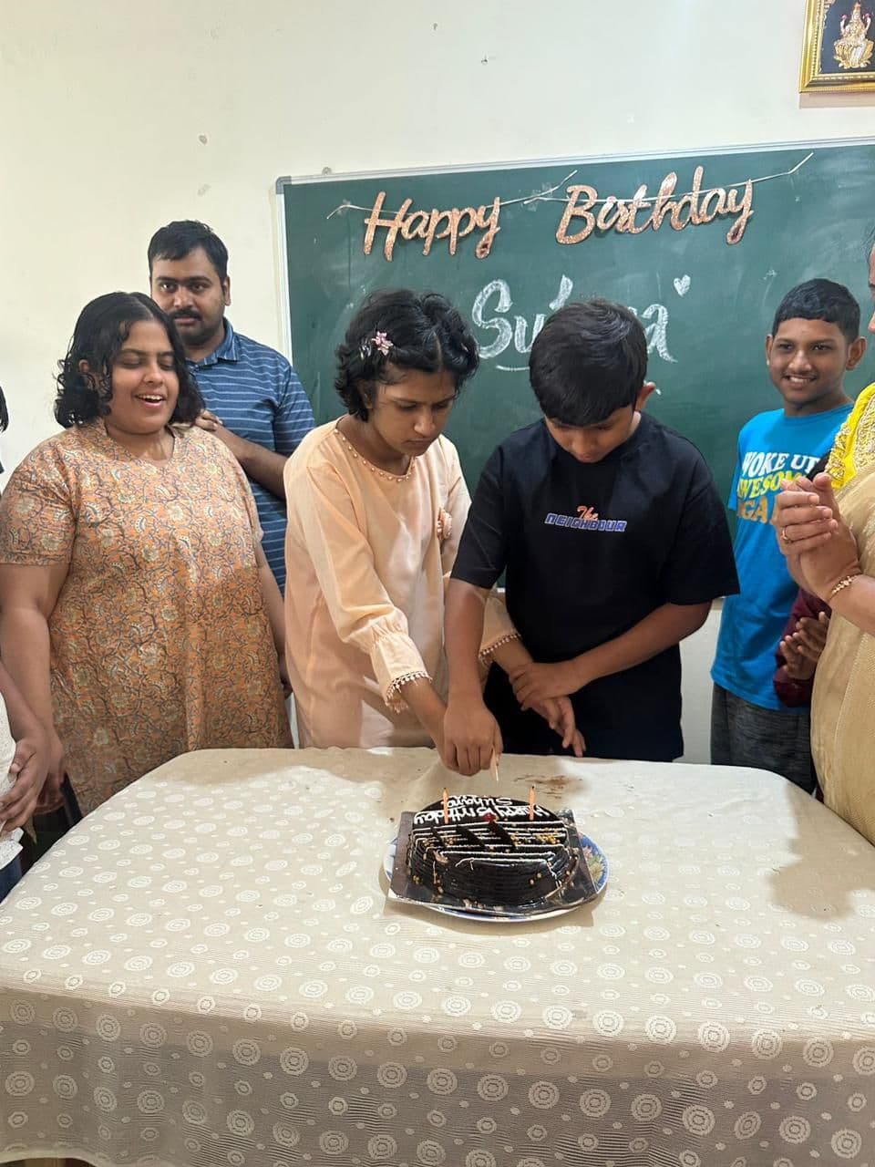 Birthday celebration with cake at the centre