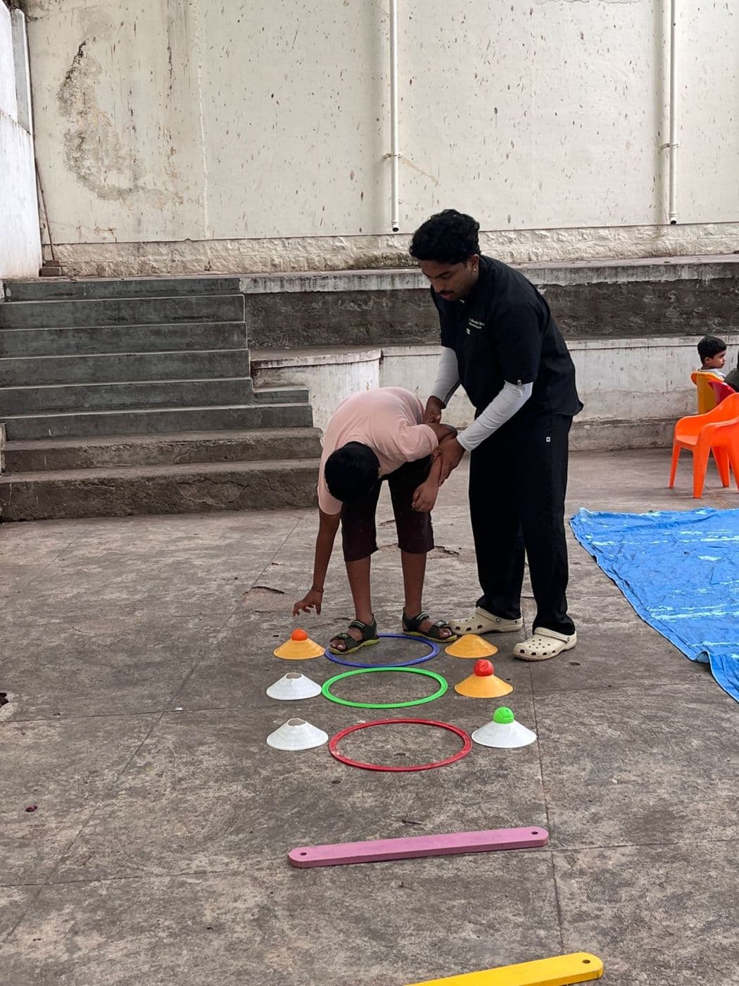 Making rangoli in the courtyard