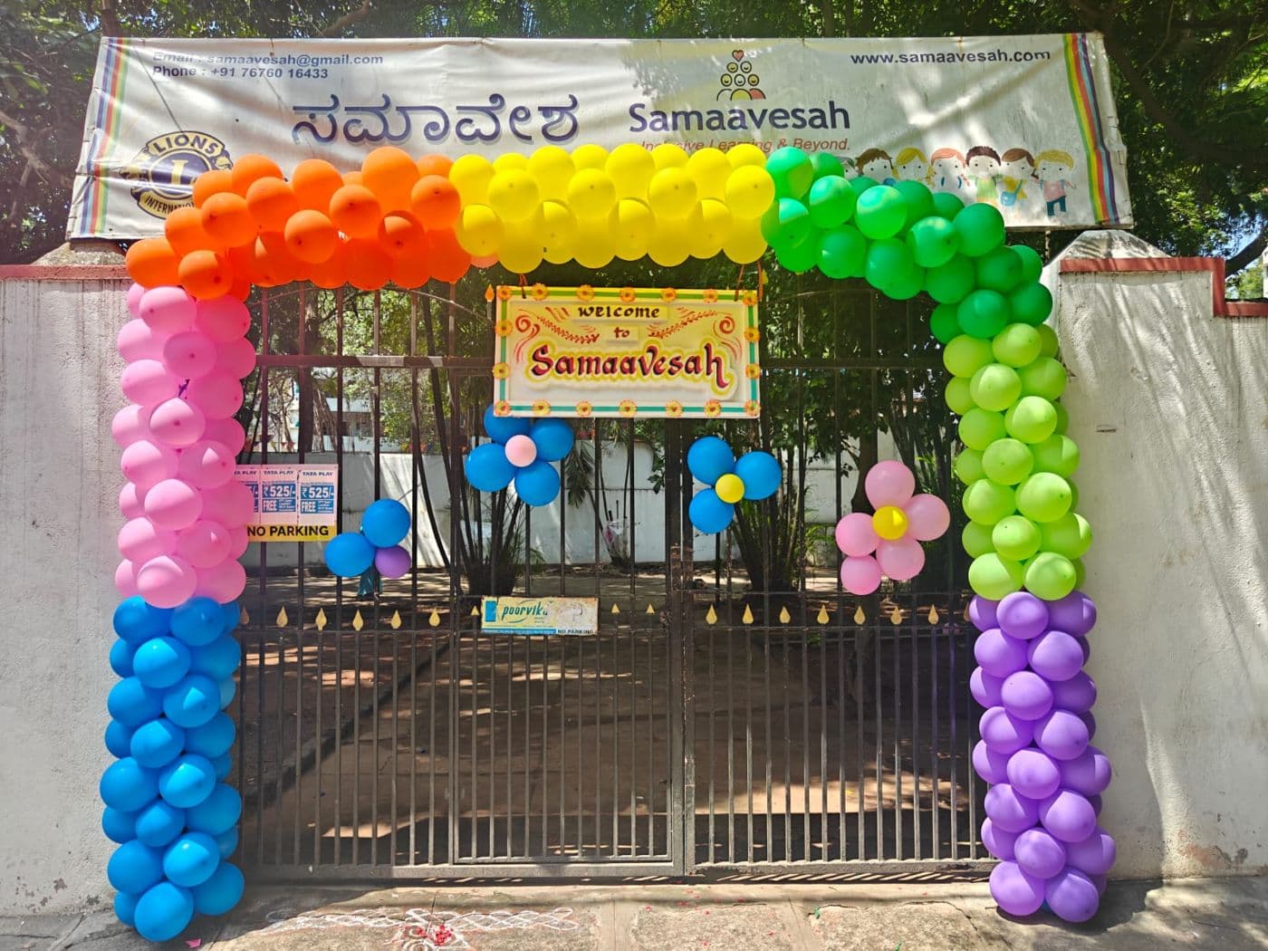 Rainbow balloon arch welcoming everyone